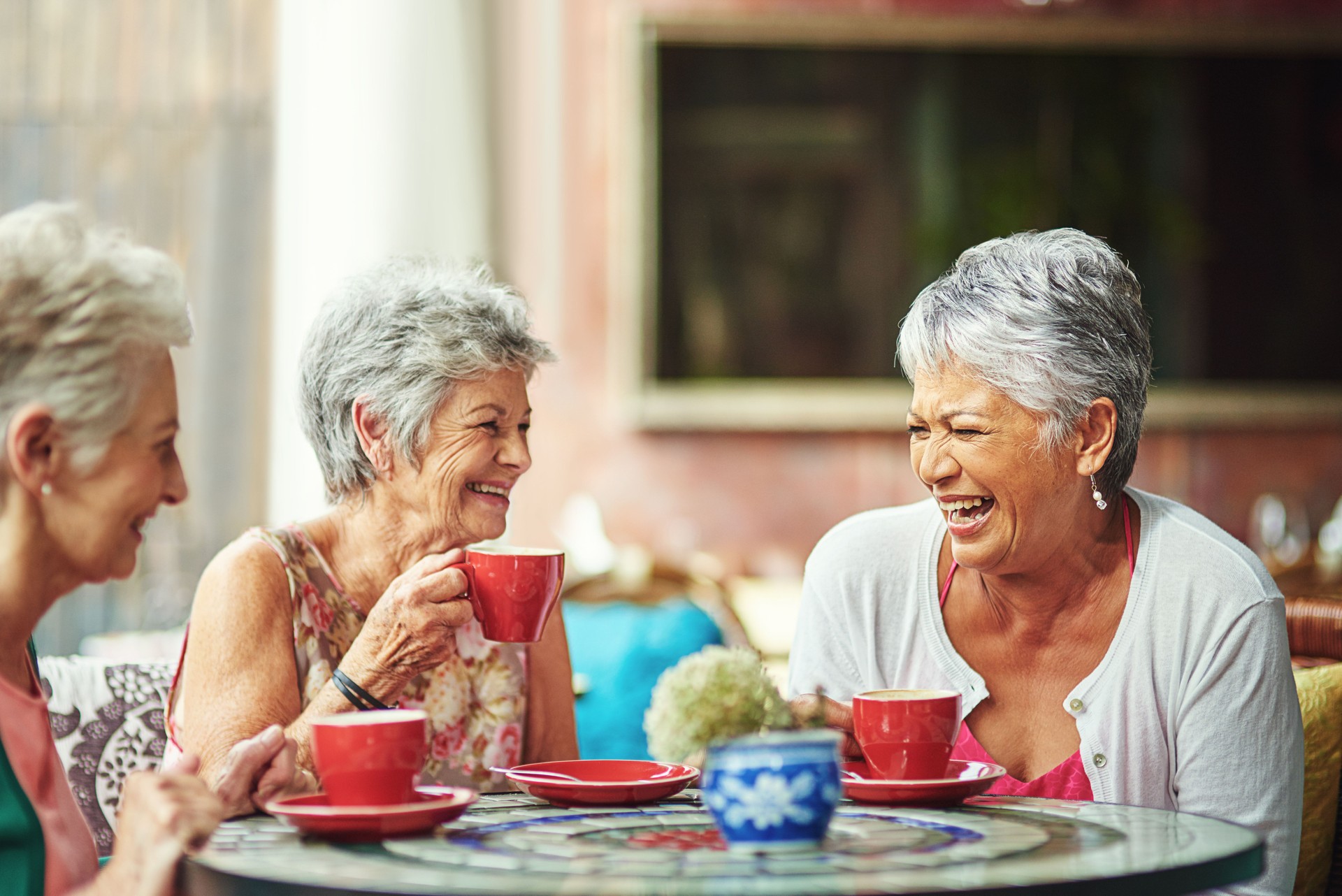 Lifelong friends catching up over coffee