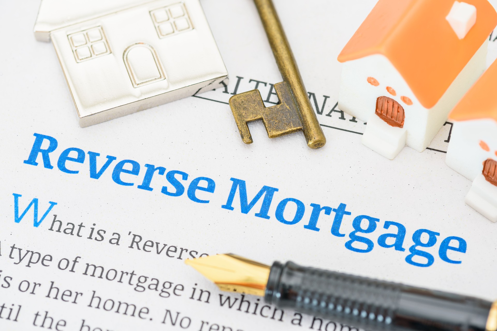 Fountain pen on a reverse mortgage document. A reverse mortgage is a loan for homeowners, converting home equity into cash. Repayment is typically deferred until the owner moves out or passes away.